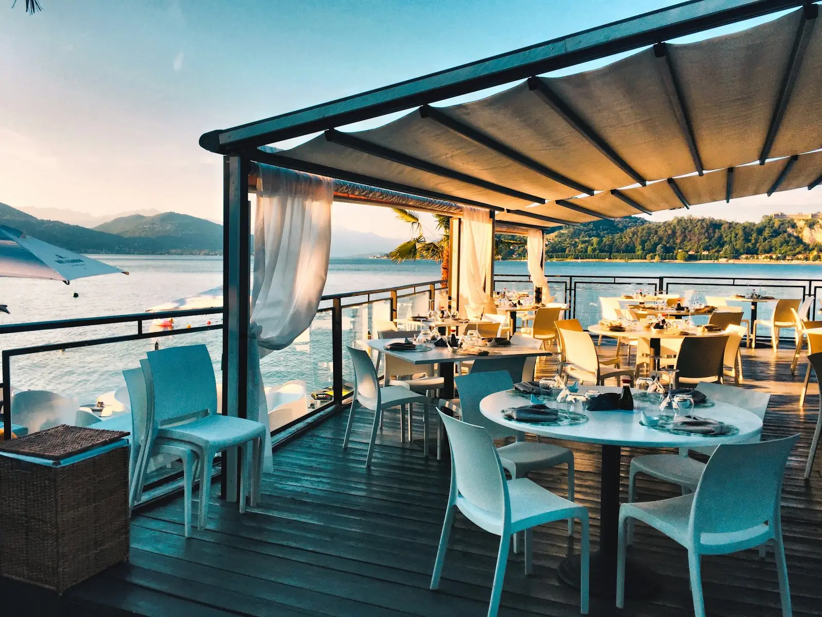 A restaurant terrace set for evening guests